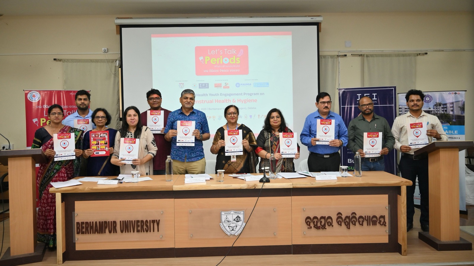 Panel discussion at Berhampur University during the Let's Talk Periods 2025 campaign, with faculty and health experts